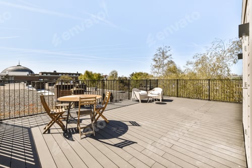Preview: a deck with a table and chairs and a fence