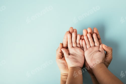 Preview: Closeup top view family hands stack palms