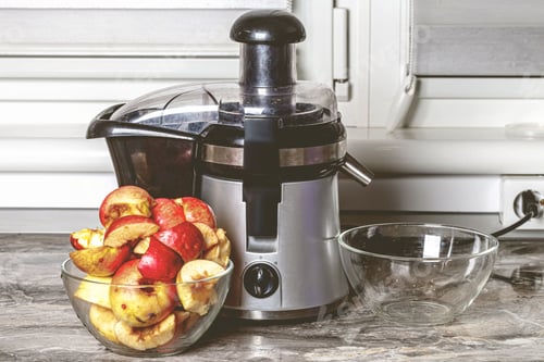 Preview: a bunch of apples sitting on a kitchen counter next to a juicer