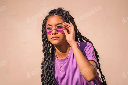 Preview: A young brunette with purple glasses in an urban session