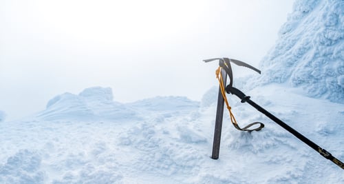 Preview: Ice ax surrounded by snow