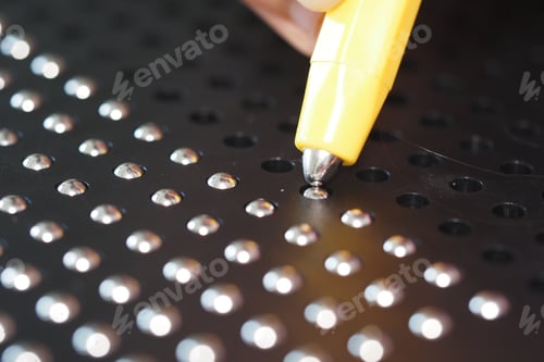 Preview: Child Engaging with Magnetic Dot Drawing Board for Creative Play