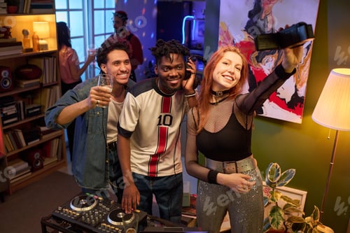 Preview: Group of young Multiethnic Friends Taking Selfie and Enjoying House Party