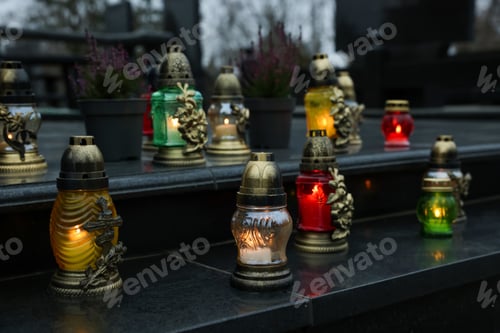 Preview: Grave lights on granite surface at cemetery