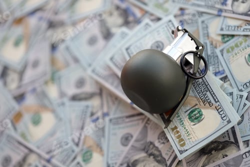 Preview: Grenade with a check against the background of huge amount of american dollar bills