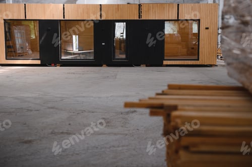 Preview: A new wooden modular prefabricated house inside in manufacturing facility