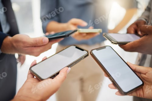 Preview: Closeup of diverse group of businesspeople using cellphones with blank screens in synchronicity whi