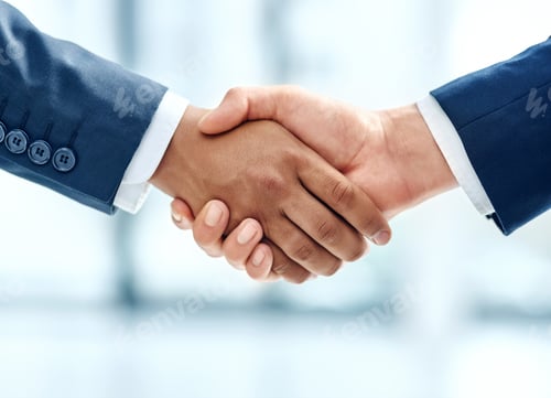 Preview: We have a deal. Closeup shot of two businesspeople shaking hands together in an office.