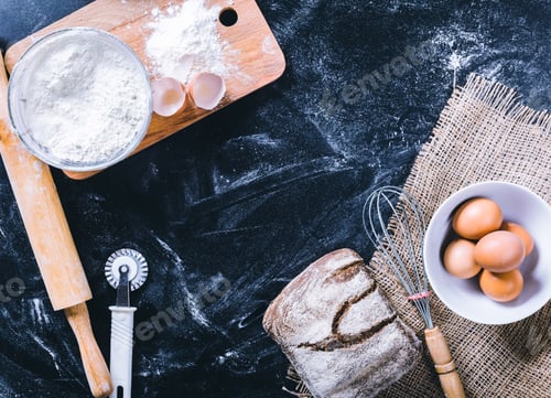 Preview: Ingredients and utensil for baking on the black board, top view
