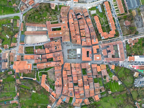Preview: Aerial top view of orange roofs of houses in a village in Basque Country