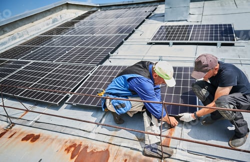 Preview: Workers building solar panel system on roof of house. Men installing photovoltaic solar module