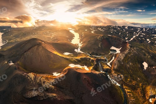 Preview: Aerial view of sunset over mysterious volcanic crater and glacier stretches