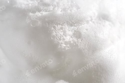 Preview: Photo of the texture of cosmetic foam or soap on a white background.