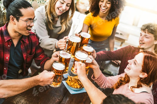 Preview: Happy multiracial friends toasting beer glasses at brewery pub