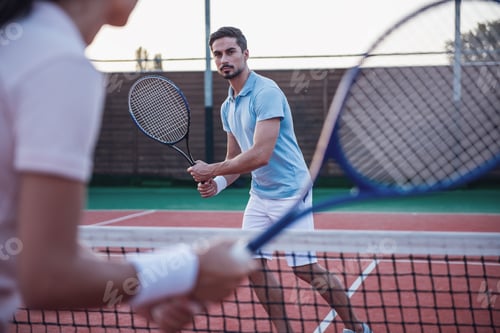 Preview: Couple playing tennis