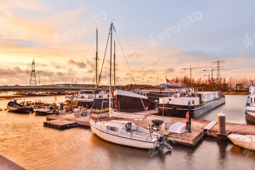 Preview: Modern vessels near quay at sunset