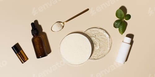Preview: Anti-aging cosmetics. Collagen powder and hyaluronic acid in Petri dishes, cosmetic bottles.