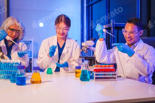 Preview: Two Asian men and women sit at a table in a laboratory, conducting research on liquids. They use