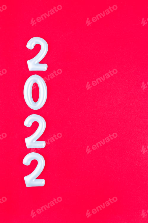 Preview: New year concept, minimalistic composition, border with number 2022, on red