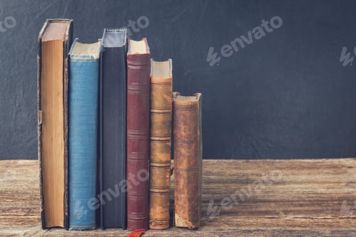 Preview: Vintage Books on a Wooden Table