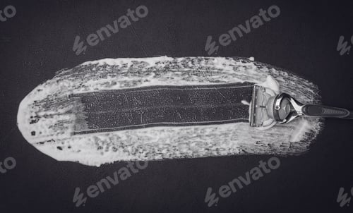 Preview: A set of items for shaving a beard on a black background.