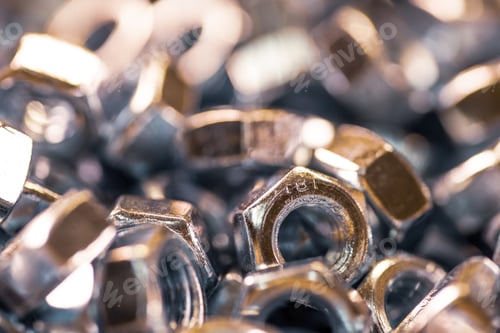 Preview: Metal chrome nuts in a chaotic order industrial background