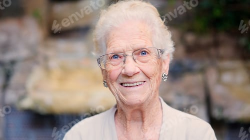 Preview: Portrait of a happy grandmother smiling at camera