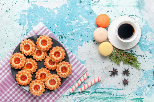 Preview: top view delicious little cookies with french macarons and coffee on blue desk cookie biscuit sweet