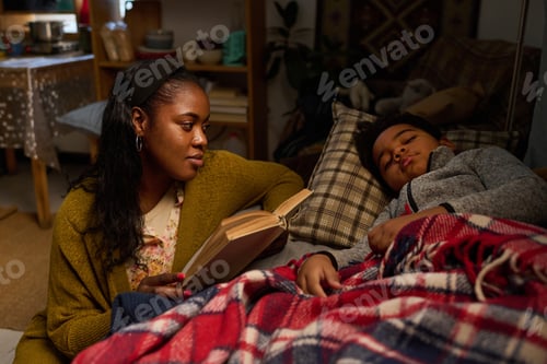 Preview: Loving Mother Reading Bedtime Story to Young Child