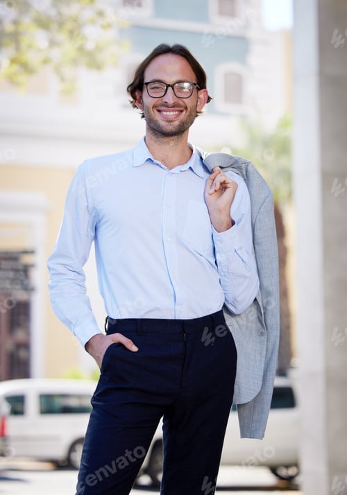 Preview: Portrait of a young businessman standing with his jacket over his shoulder while out in the city