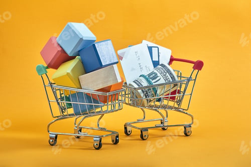 Preview: the concept of advertising. shopping cart with multi-colored cubes. it symbolizes a lot of purchases
