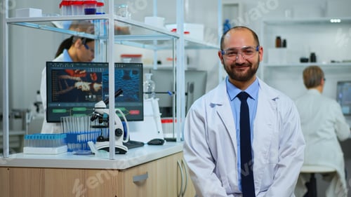 Preview: Experienced man scientist looking at camera smiling