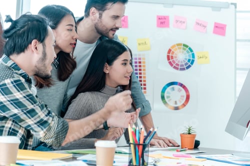 Preview: Group of business people meeting in conference room brainstorming consult business document