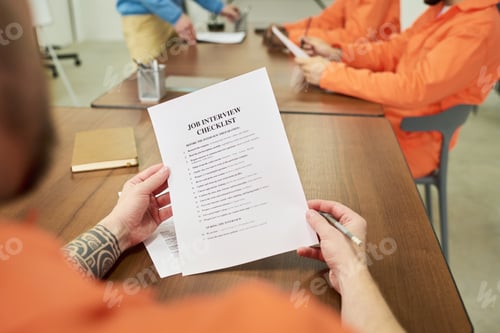 Preview: Group of Incarcerated Young Adult Men Studying Job Interview Preparation Materials