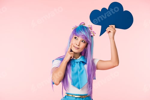 Preview: Pensive asian anime girl holding thougth bubble isolated on blue