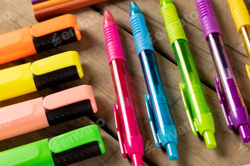 Preview: Composition of markers, pencils and pens on wooden surface