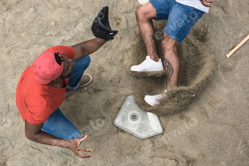 Preview: baseball player reaching base during game on court