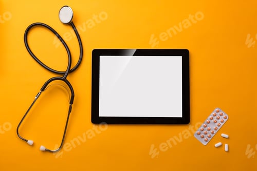 Preview: Stethoscope in doctors desk with digital tablet and pills