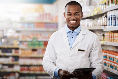 Preview: Portrait of a young pharmacist working in a chemist