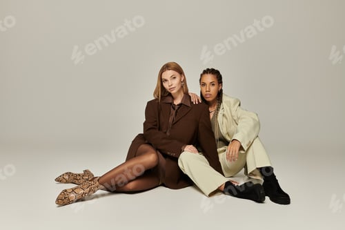 Preview: A stylish young lesbian couple embraces autumn fashion in a cozy indoor setting