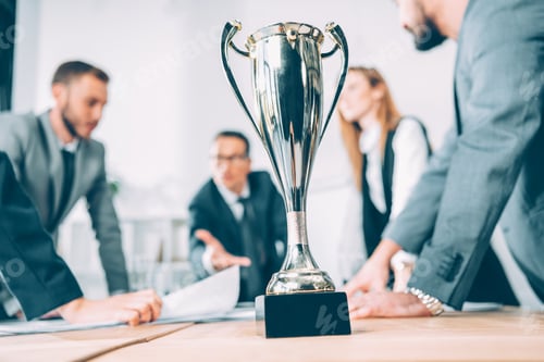 Preview: champion cup standing on table at conference hall in office