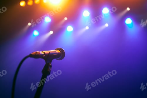 Preview: Microphone on stage against colorful spotlights