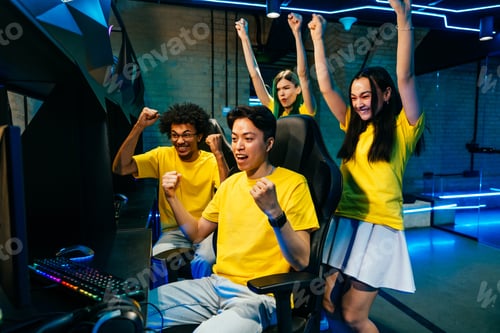 Preview: Multiethnic group of young friends playing videogames