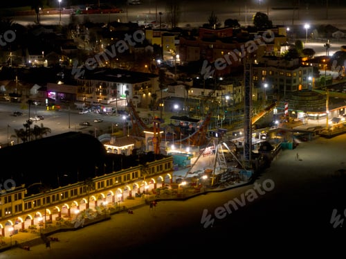 Preview: Santa Cruz Beach Boardwalk illuminated with lights on a dark night