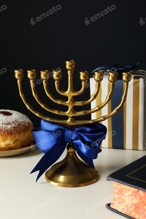 Preview: Hanukkiah, donut and gift box on black background