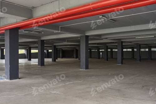 Preview: Empty underground parking lot or garage interior with concrete columns.