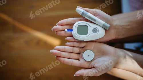Preview: Close up of hands with diabetes supplies and devices.