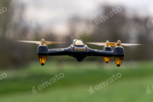 Preview: Closeup of a drone in a field under the sunlight with a blurry background
