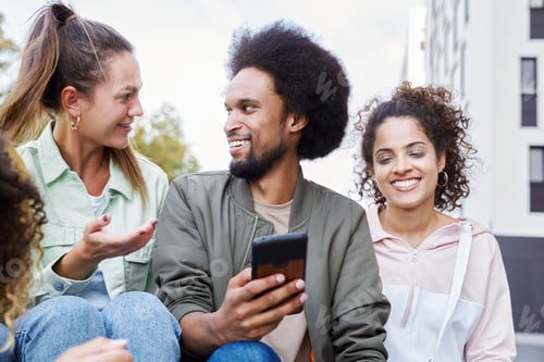 Preview: Group of friends spending time together outdoors