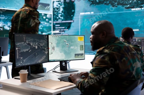 Preview: Military staff in a high tech monitoring room work on data integration